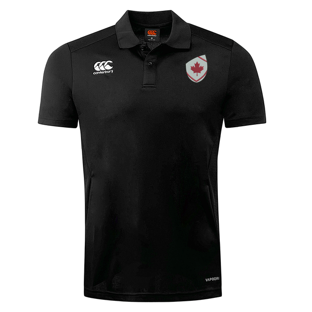 The EMB Canterbury Canada Shield Club Dry Polo is a black short-sleeve rugby shirt with a white logo, Canada maple leaf badge, and Vapodri Technology for superior comfort.