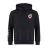 The Canterbury Canada Shield Club Hoodie by EMB Canterbury features black sweatshirt fleece, a front pocket, a maple leaf shield on the left chest, and three white stripes on the right sleeve—ideal for any rugby supporter.