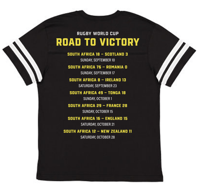 A black South Africa RWC 23 Champions Football Tee that says "Road to Victory" for South Africa Rugby, WRS LAT.