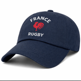 The Nations of Rugby France Dad Cap by EMB S&S Activewear is a navy blue cotton twill cap featuring "FRANCE RUGBY" text and a red rooster logo embroidered on the front—ideal for any France Rugby supporter.