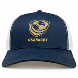 The EMB S&S Activewear USA Rugby Bronze Retro Trucker Cap is a navy blue and white hat featuring the USARUGBY logo and gold text on the front panel.