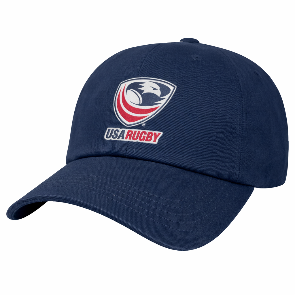The EMB S&S Activewear USA Rugby Dad Cap is a navy blue hat with an embroidered USA Rugby Crest featuring an eagle head and red, white, and blue details on the front.