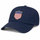 The USA Rugby Original Olympic Dad Cap by EMB S&S Activewear is a navy limited edition cap with a front shield emblem featuring stars and red and white stripes.