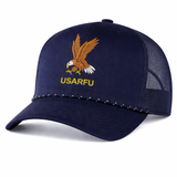 The EMB Augusta USA Rugby Heritage Braid Cap is a navy trucker mesh baseball cap featuring an embroidered eagle and "USARFU" text on the front, inspired by classic USA Rugby designs.