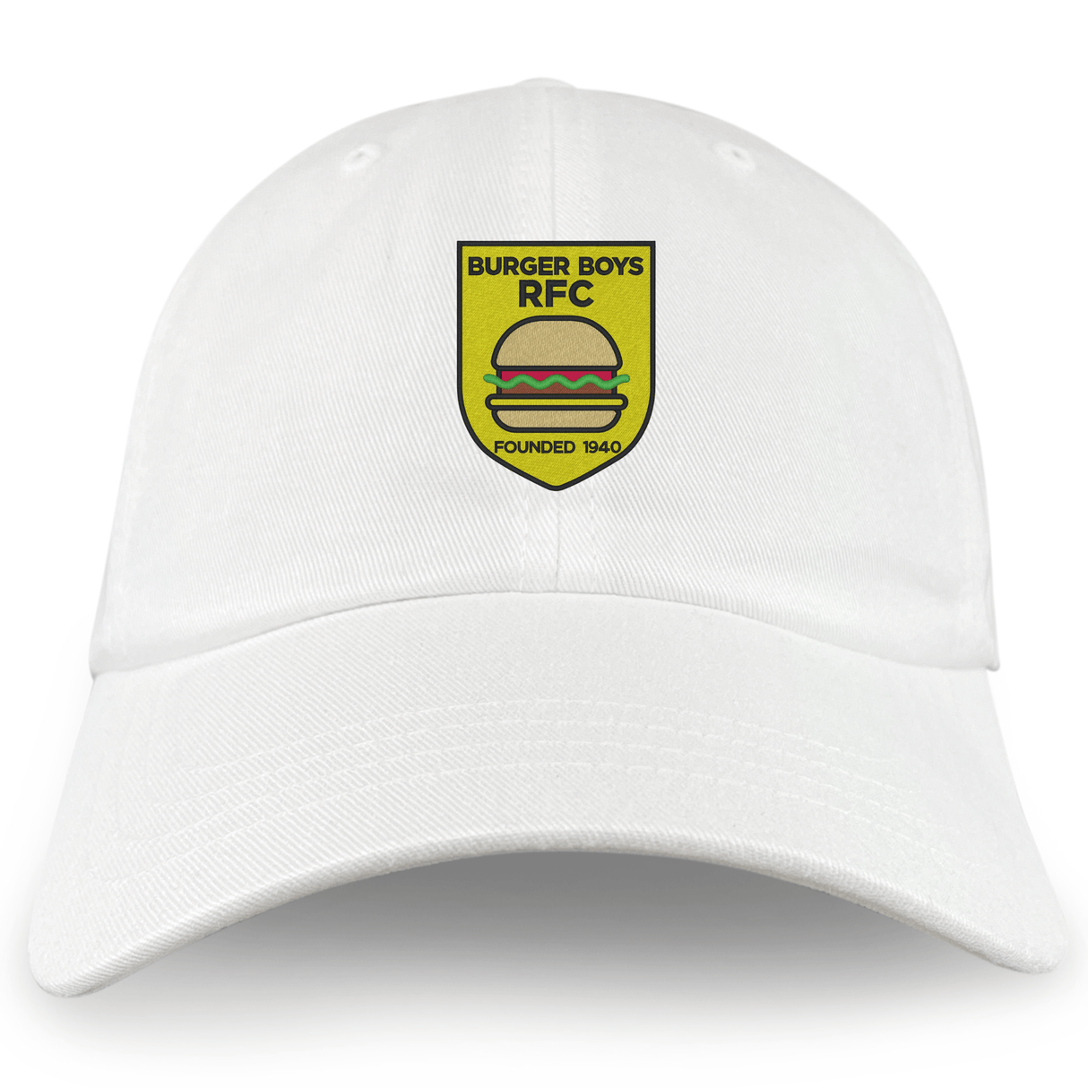 The EMB S&S Activewear Burger Boys RFC Adult Low-Profile Cotton Twill Dad Cap is white, with an embroidered yellow shield showing a burger and the text "BURGER BOYS RFC FOUNDED 1940" on the front.