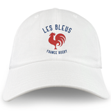 The Les Bleus France Rugby Dad Cap by EMB S&S Activewear is a white cotton twill hat featuring a red rooster and blue "LES BLEUS FRANCE RUGBY" text—a must-have for any France Rugby fan.
