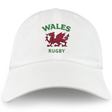 The Nations of Rugby Wales Dad Cap by EMB S&S Activewear is a white cotton hat embroidered with "WALES RUGBY" in green and a bold red Welsh dragon—perfect for fans.