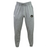 The Eau Claire Orcs Leisure Sweatpant by EMB Canterbury is designed in cozy gray sustainable fabric, featuring a drawstring waist and embellished with a black circular logo on the right side and a white one on the left.
