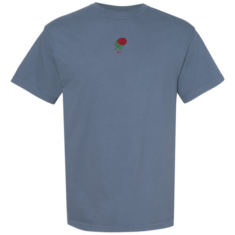 The England Vintage Comfort Tee by EMB S&S Activewear is a heavy comfort blue t-shirt with a small red rose and the word "stay" centered on the chest.