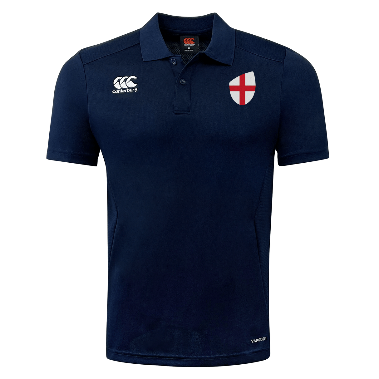 Navy blue polo shirt with an EMB Canterbury logo on the left chest, St. George's Cross badge on the right chest, and a button-up collar. This stylish piece is part of the EMB Canterbury England Shield Club Dry Polo range, offering both comfort and a nod to heritage.