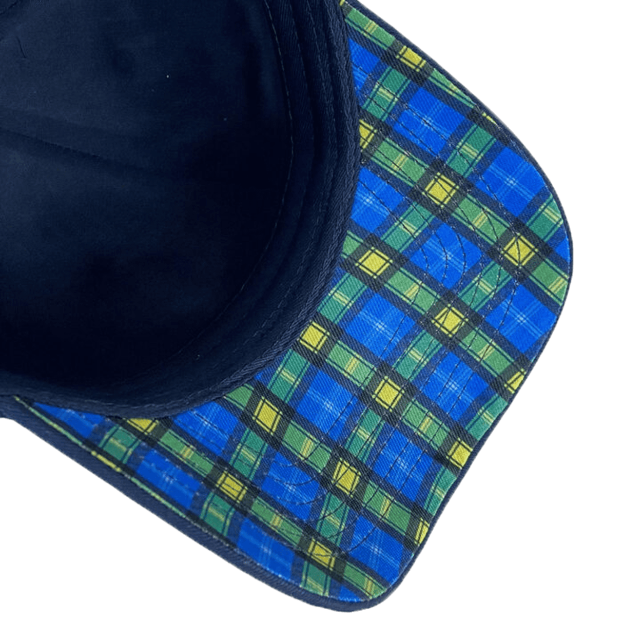 The underside of the Ellis Rugby Doddie Weir Scotland Cap boasts a vibrant blue and green plaid, made from 100% organic cotton.