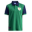 The Ellis Rugby Ireland Rugby 1948 Polo, in green and navy, features a collar with a shield and shamrock emblem on the chest plus a patch on the sleeve, showcasing timeless style.