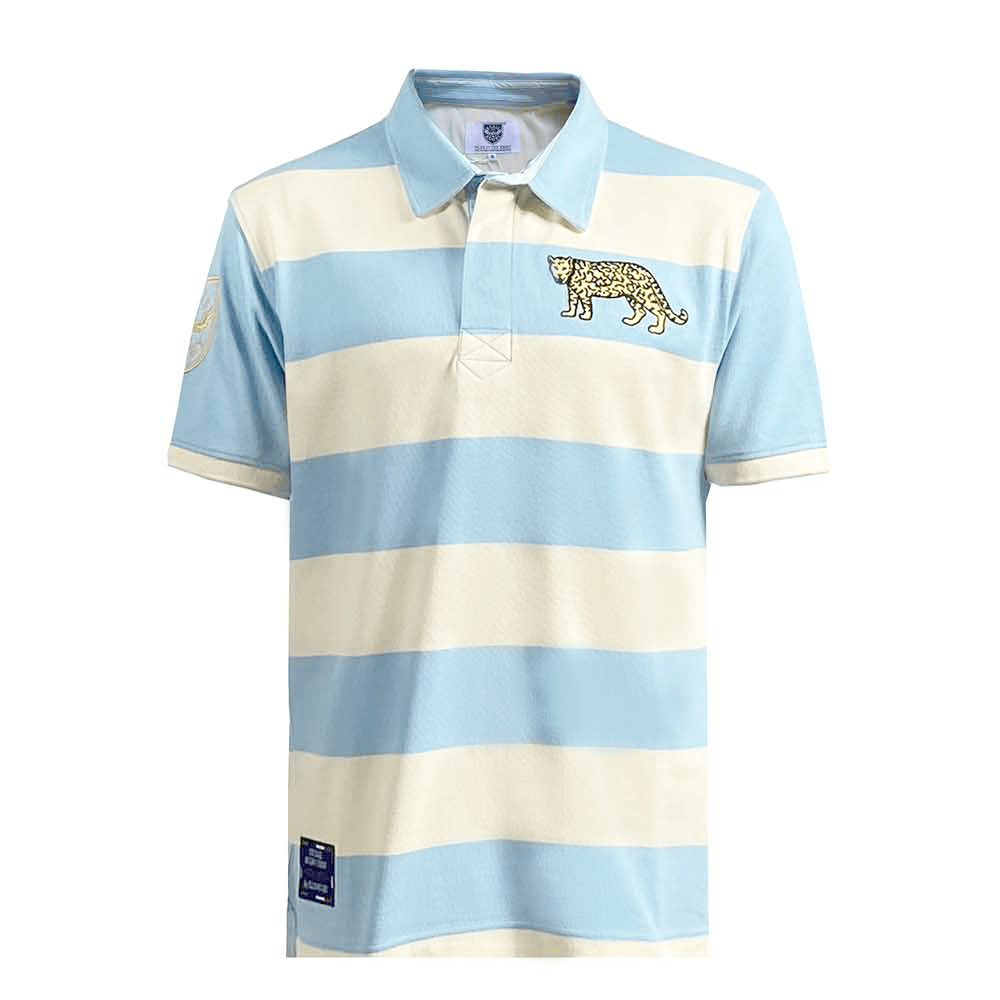 The Ellis Rugby Argentina Rugby Polo is a light blue and white striped jersey made from 100% cotton featuring a jaguar emblem on the chest and a small Ellis Rugby patch on the bottom left for authenticity.
