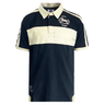 The Ellis Rugby Natal Sharks Vintage Polo, in black and beige with stripes, features a collar, "Natal Rugby" text and logo on the front, plus an emblem on the sleeve. Ideal for Currie Cup fans.