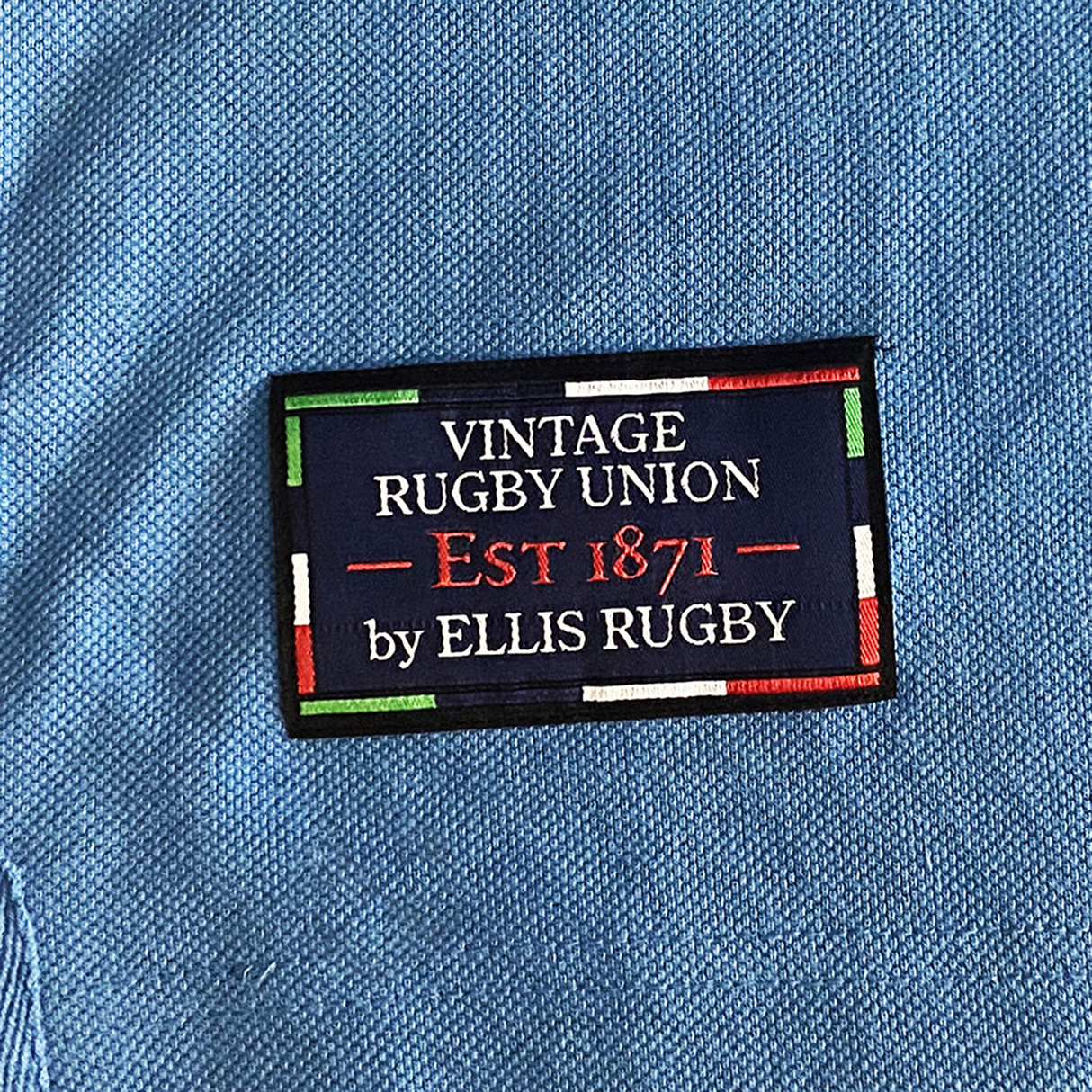 The Northern Transvaal Bulls Vintage Polo by Ellis Rugby features a sewn label, "Vintage Rugby Union Est 1871 by Ellis Rugby," highlighted with red, green, blue, and white lines. Its design reflects the esteemed heritage of Northern Transvaal Rugby.