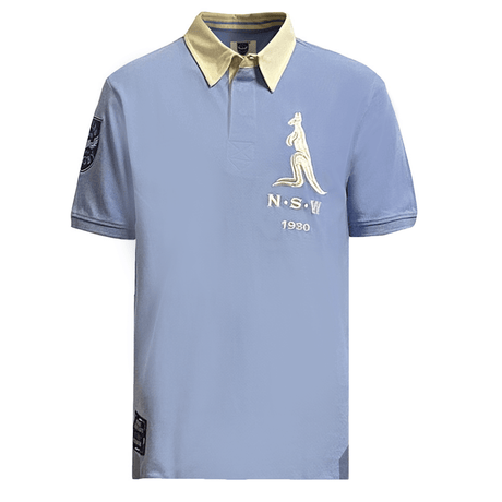The Ellis Rugby New South Wales Vintage 1930 Polo features a light blue color with a beige collar, adorned with a kangaroo emblem and "N.S.W. 1930" on the front, capturing the classic style of New South Wales Rugby as endorsed by Ellis Rugby.