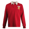 The Ellis Rugby Wales 1976 Grand Slam Classic Rugby Shirt is a red long-sleeve shirt with a white collar, featuring an embroidered three-feather and crown logo on the chest, capturing the iconic style of Wales' historic victory.