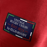 Vintage rugby union t-shirt - red - Canadian rugger - Ellis Rugby.
Revised sentence: Vintage Ellis Rugby 21 Club Collection 1902 Canada Rugger t-shirt in red.