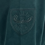 The Ellis Rugby Springbok 1995 Vintage Long Sleeve Rugby Shirt features an embroidered fabric patch with "Ellis Rugby," "1871," and a winged emblem, celebrating South Africa's rugby heritage reminiscent of the iconic 1995 Springboks.