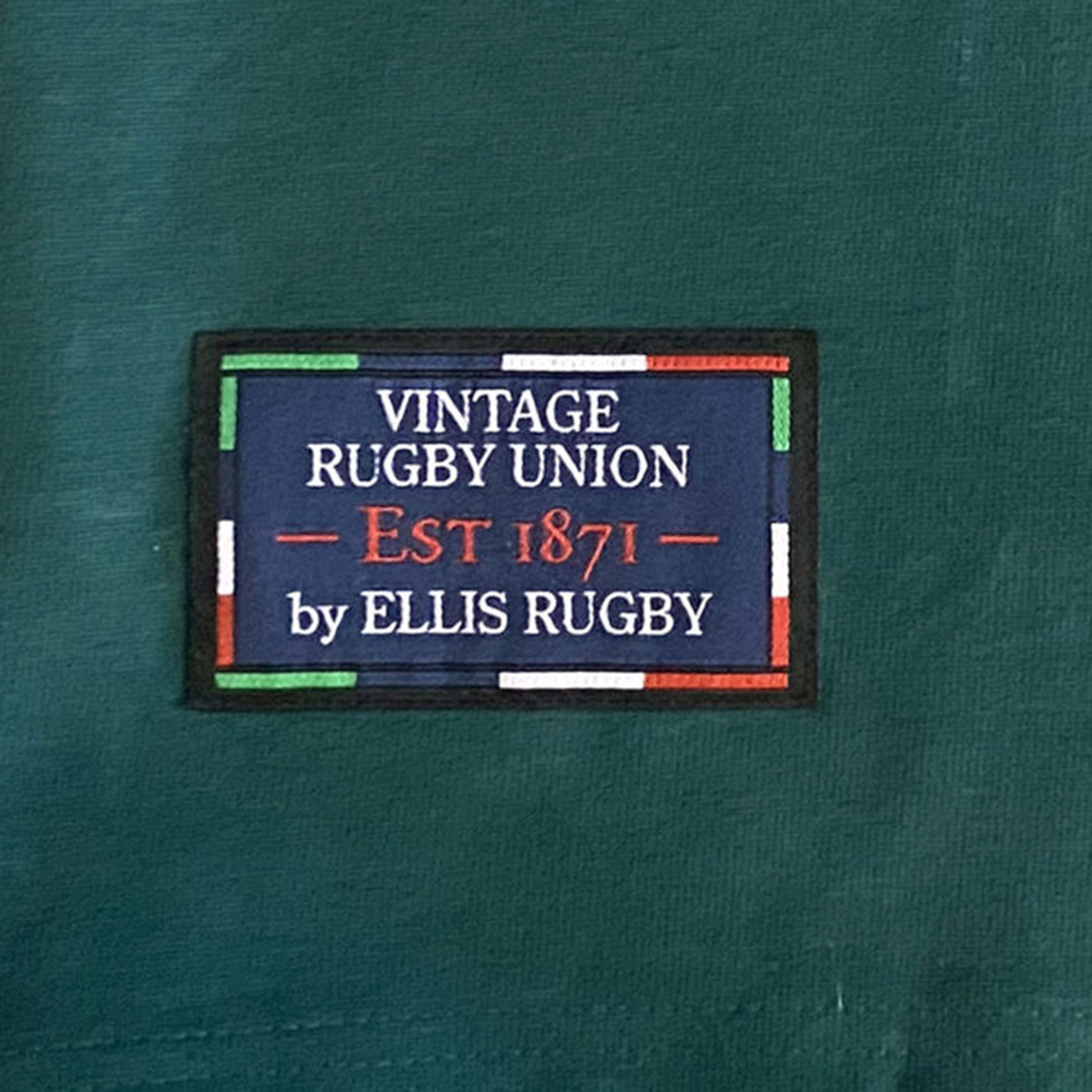 The green fabric label says "Ellis Rugby Springbok 1995 Vintage Long Sleeve Rugby Shirt by Ellis Rugby," honoring South Africa's rugby heritage with white, red, and green striped border details inspired by the iconic Springboks 1995 Rugby Shirt.
