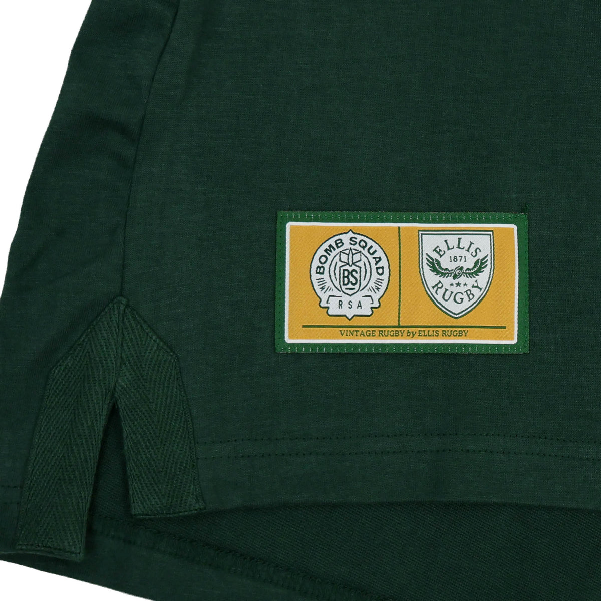 A dark green South Africa Bomb Squad Rugby T-Shirt by Ellis Rugby featuring a rectangular patch with Bomb Squad and Ellis Rugby logos.