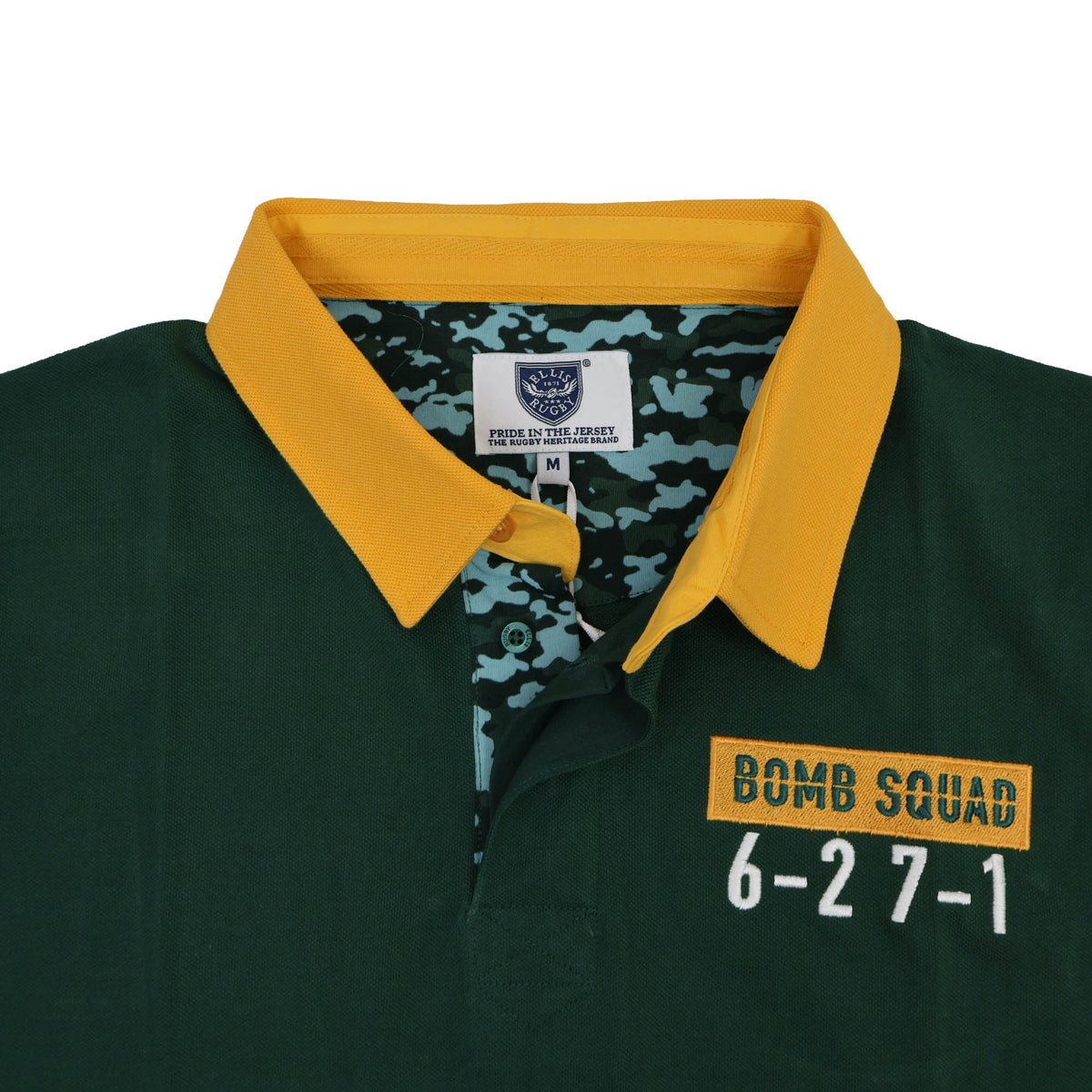 Dark green Bomb Squad Rugby Polo by Ellis Rugby featuring a yellow collar, a camouflage inner lining, and a chest patch reading “BOMB SQUAD 6-27-1”.