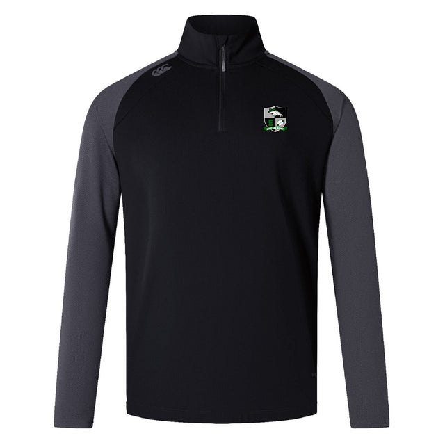 The EMB Canterbury Eagle High Mustangs Elite First Layer features a black quarter-zip design, grey long sleeves, VapoDri moisture control, and an embroidered team logo—ideal as a rugby training top.