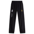 The Exiles Rugby Football Club Cuffed Hem Stadium Pant by EMB Canterbury features an elastic waistband, cuffed hem, white branding, and a yellow-green embroidered crest on the upper left leg.