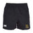 The Exiles Rugby Football Club Professional Polyester Rugby Short by EMB Canterbury features an elastic waistband, white Canterbury logo on the left leg, green and gold Exiles RFC crest on the right, and is made from durable polyester for lasting performance.