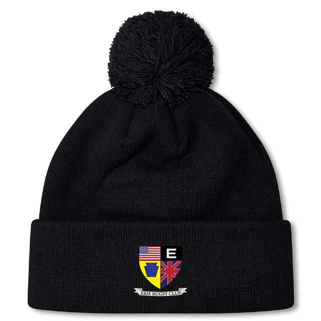 The Erie Rugby Club Pom Pom Beanie by EMB Canterbury is a black fleece-lined hat with a pom-pom and a multicolored crest featuring the US and UK flags, a yellow shield, and "EIRE RUGBY CLUB" text.