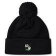 The Eagle High Mustangs Pom Pom Beanie by EMB Canterbury is a black knit hat with a pom-pom, an embroidered eagle and rugby ball logo with green accents on the cuff, and a cozy fleece lining for extra warmth.