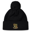The Exiles Rugby Football Club Pom Pom Beanie by EMB Canterbury is a black, fleece-lined hat with a pom-pom and the Exiles RFC crest embroidered on the front cuff for added warmth and style.