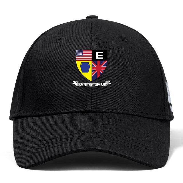 The Erie Rugby Club Flexfit Drill Cap by Canterbury features a black curved brim, crest with American & British flags, yellow & blue emblem, black & white “E,” “ERIE RUGBY CLUB” banner, and premium Flexfit comfort by EMB Canterbury.