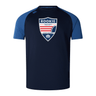A navy-blue Cincinnati Rookie Rugby Elite Training Tee by Canterbury with blue sleeves, featuring the "Rookie Rugby Cincinnati" logo on the chest. Made from lightweight and durable Vapodri fabrics, it's perfect for both training and casual wear.