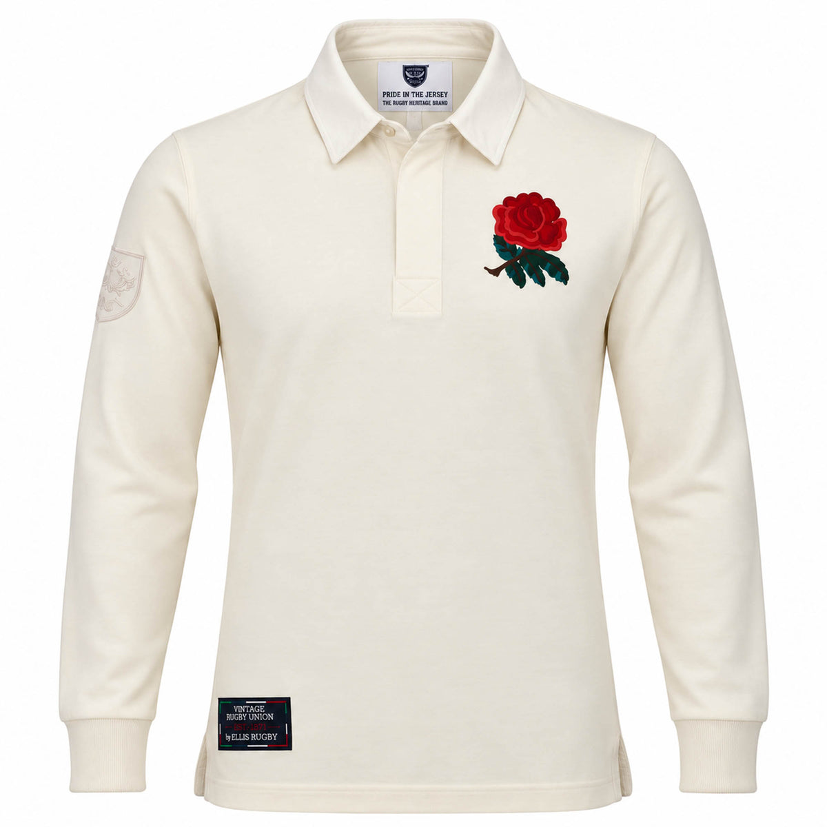 The Ellis Rugby England Rugby 1991 Shirt 1992 Grand Slam features cream long sleeves, a red rose emblem on the left chest, a patch on the left sleeve, and a black label above the hem. Inspired by England’s iconic 1992 Grand Slam victory, this shirt pays tribute to classic rugby heritage.