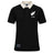 The New Zealand Rugby 1924 Polo by Ellis Rugby is a black, short-sleeved polo shirt featuring a contrasting white collar, a white fern and “1924” on the chest, and a rectangular patch near the hem—a subtle nod to New Zealand Rugby heritage.