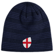 The England Shield Beanie by EMB Canterbury is a navy blue beanie with horizontal stripes, featuring an emblem of a red cross on a classic England shield.