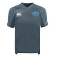 The King's Point Rugby Vapodri Evader Jersey by EMB Canterbury, in gray, displays the Canterbury logo on the right side and the "USMA Kings Point Rugby" logo on the left. It incorporates a VapoDri finish for superior moisture-wicking, offering maximum comfort during intense games.