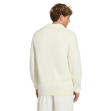 A man faces away, wearing the off-white France FFR 120 Year Cardigan by adidas with a shawl collar and matching pants, paying tribute to French rugby heritage against a plain background.