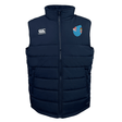 The EMB Canterbury Fiji Shield Core Gilet is a dark blue padded vest featuring Thermoreg insulation, a high collar, the Canterbury logo on the left, and a shield emblem on the right.