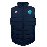 The EMB Canterbury Fiji Shield Core Gilet is a dark blue padded vest featuring Thermoreg insulation, a high collar, the Canterbury logo on the left, and a shield emblem on the right.