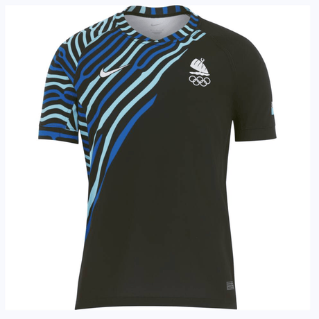A black Nike athletic shirt with blue and teal stripe patterns on one shoulder, featuring a white swoosh logo and Olympic rings on the chest. This Fiji Olympics 7's Replica Away Jersey by Nike is inspired by the Fiji Olympics 7's team.