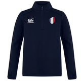 The France Club Shield 1/4 Zip Training Top by EMB Canterbury is navy, with a left-side logo and a French flag emblem on the right. Its durable fleece offers comfort and warmth, making it perfect for rugby season.