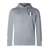 The EMB Canterbury France Shield Club Lightweight Hoodie is a gray hoodie with a front pocket and drawstrings, featuring a chest France shield crest with vertical red, white, and blue stripes—ideal for rugby fans.