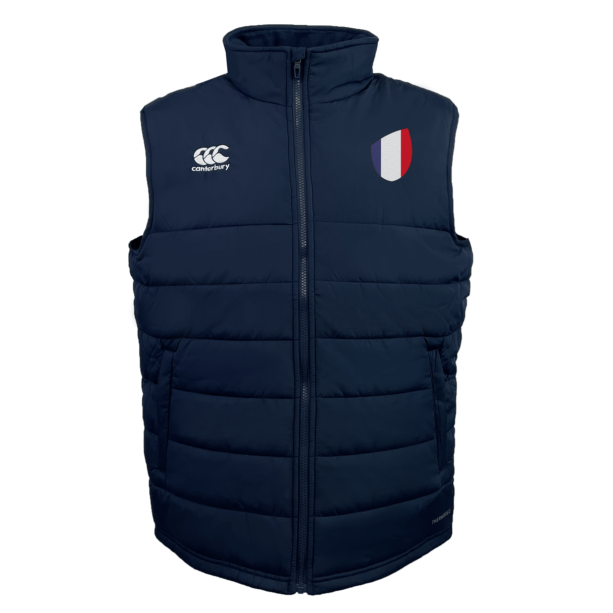 The EMB Canterbury France Shield Core Gilet, a navy blue padded vest with Thermoreg Insulation, features a high collar and front zipper. A logo adorns the left chest, while a red, white, and blue patch decorates the right. Ideal for warmth and style.