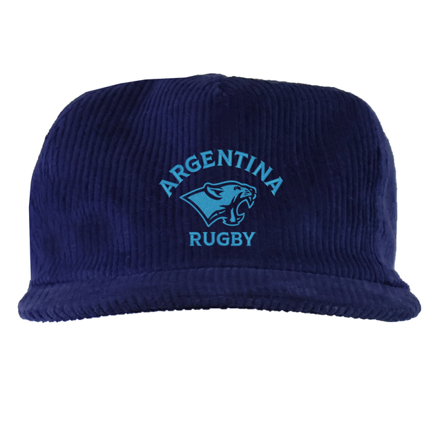 The EMB Weld Nations of Rugby Argentina Corduroy Field Trip Cap features "ARGENTINA RUGBY" and a puma head logo in light blue embroidery on navy, blending classic corduroy style with national rugby pride.