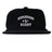 Introducing the EMB Weld Birmingham Rugby Text Logo Corduroy Field Trip Cap: a black corduroy snapback featuring “Birmingham Rugby” embroidered in crisp white lettering on the front. Blending timeless workwear aesthetics with modern comfort, this cap is the perfect choice for fans who love a classic look and easy fit.
