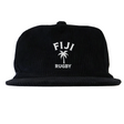 The EMB Weld Nations of Rugby Fiji Corduroy Field Trip Cap features black corduroy with white "FIJI RUGBY" embroidery and a palm tree graphic—a must-have for Fiji Rugby fans.
