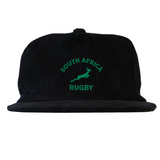 The EMB Weld Nations of Rugby South Africa Corduroy Field Trip Cap features black corduroy with "South Africa Rugby" and a green springbok logo—ideal for showing your support.