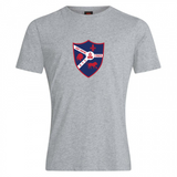 The Fort Wayne Rugby Club Plain Tee by WRS Canterbury is a gray T-shirt made with a cotton-rich blend. It features a colorful crest with red, blue, white hues and displays a fleur-de-lis, lion, chess knight along with "Fort Worth" and "1968," combining style and comfort.